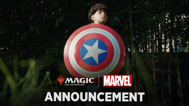 Player holds Captain America's shield in MTG promo